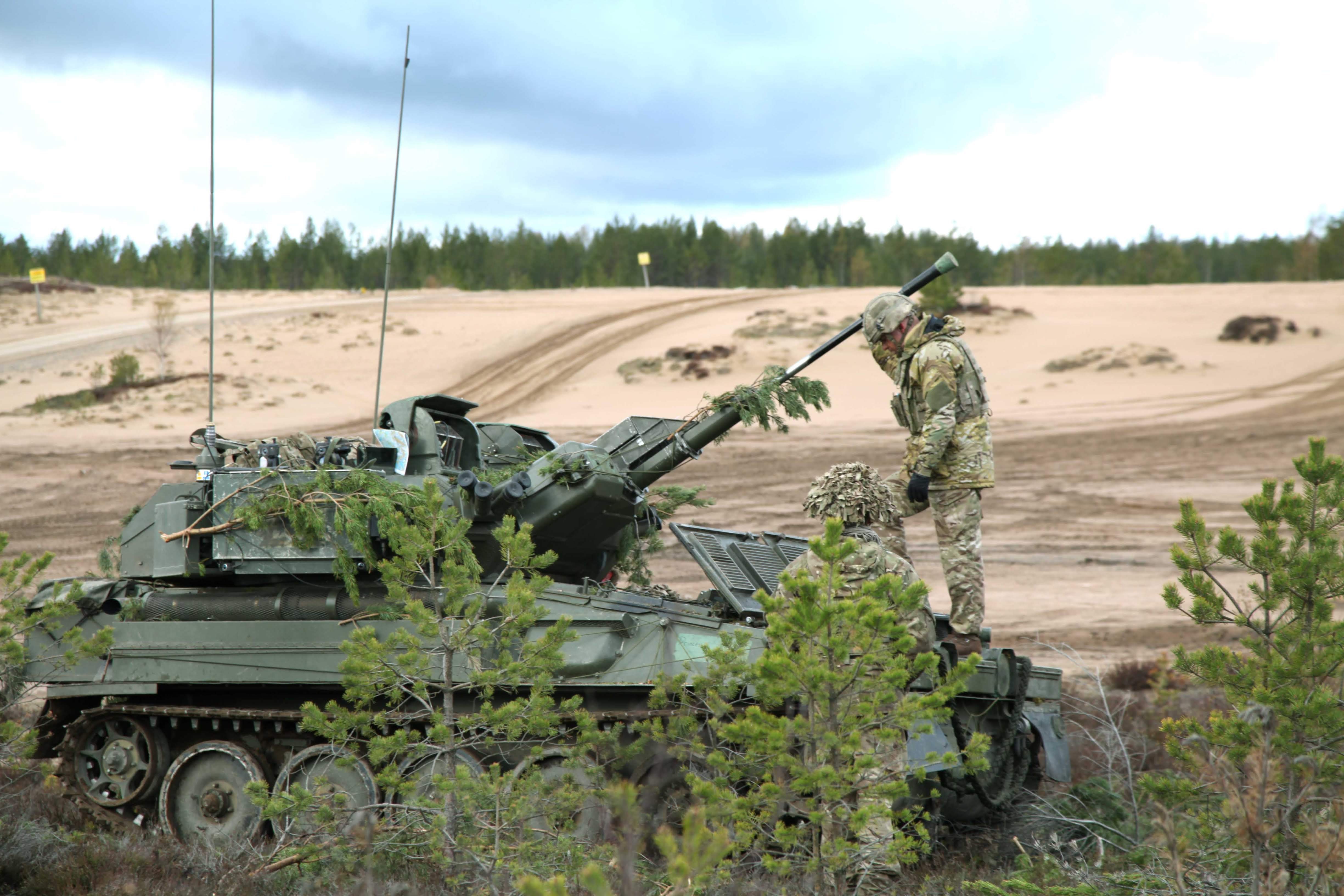 Soldiers on a Scimitor tank