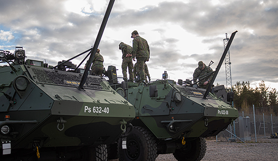 Reservists studying armoured personnel carrier Sisu XA-185.