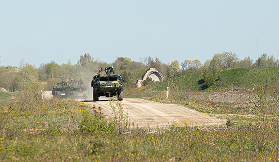 Three Army Pasi vehicles on a gravel route in Estonia in Hedgehog 22.