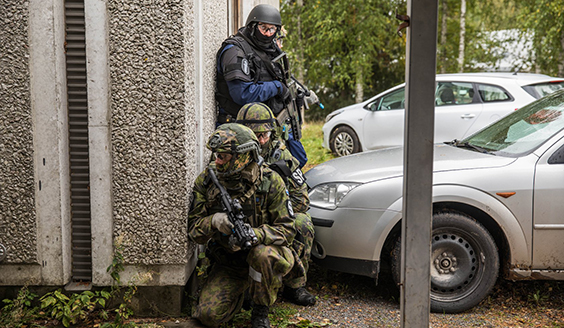 Military police and police armed around the house