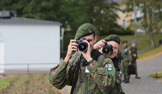 Two conscripts happily taking photographs